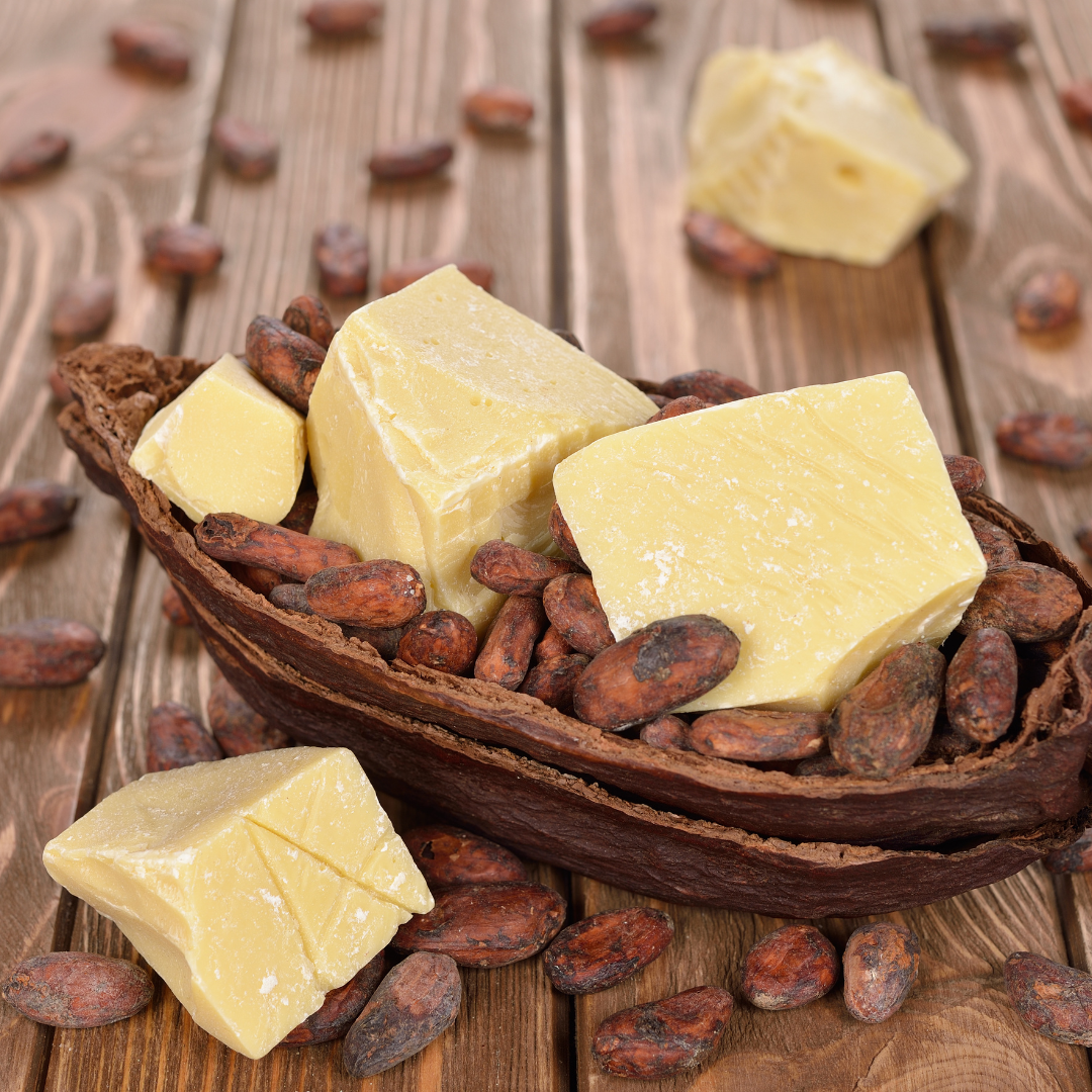 a wooden bowl full of cheese and nuts.
