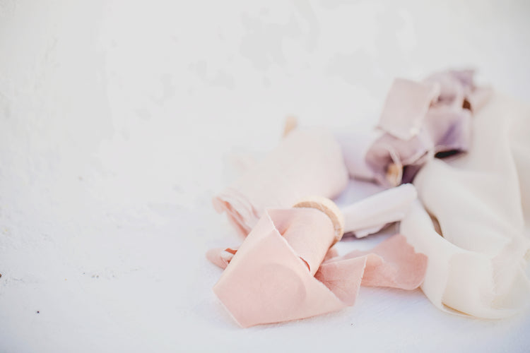 Fabric and ribbons on the floor.